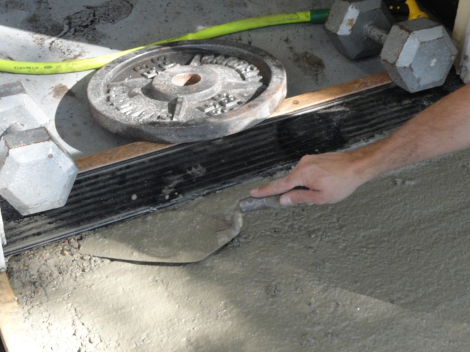 smoothing out concrete slab