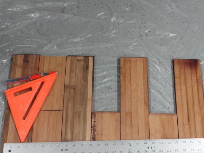 measuring and cutting plywood for DIY sliding barn door laminate wood flooring