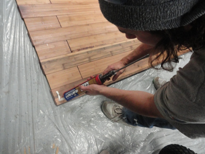 gluing laminate wood flooring to plywood for DIY sliding barn door
